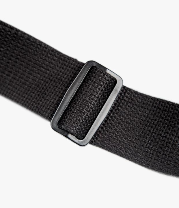 Close-up of the strap's tri-glide buckle for easy adjustment. 