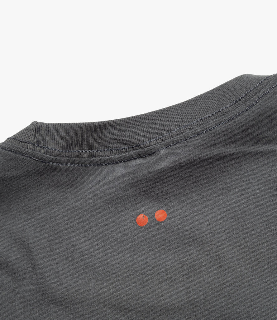 Closeup of back of tee with orange Double Dot print.