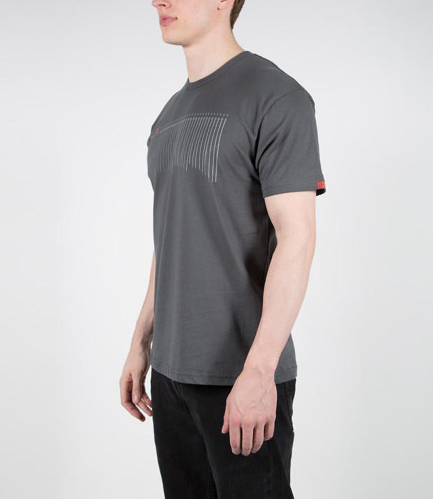 Sideview of model wearing tee with printed Fret12 logo on sleeve.