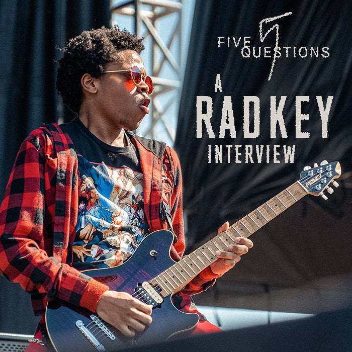 Isaiah Radke playing guitar on stage. From our RADKEY interview 