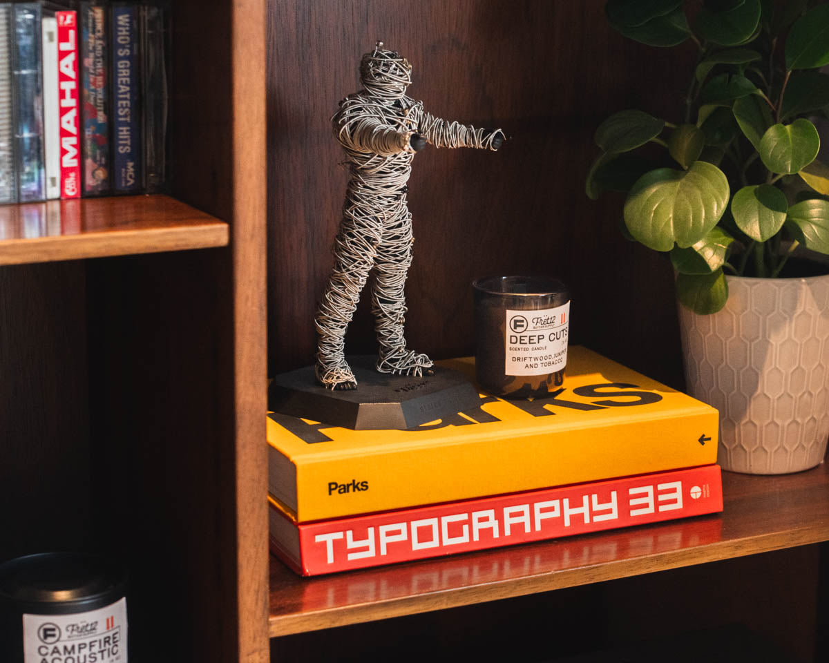 String Thing on display, paired with design books, cassettes, and the Deep Cuts FRET12 Candle.
