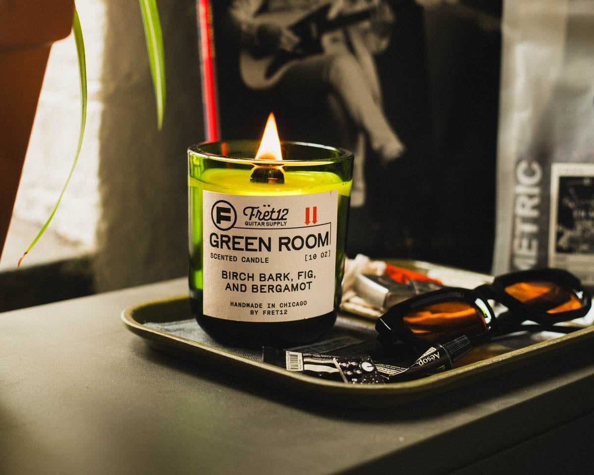 The FRET12 candles are hand-poured at our Studio. The Green Room candle featured here with Metric Coffee for FRET12, and a vinyl record in the background.