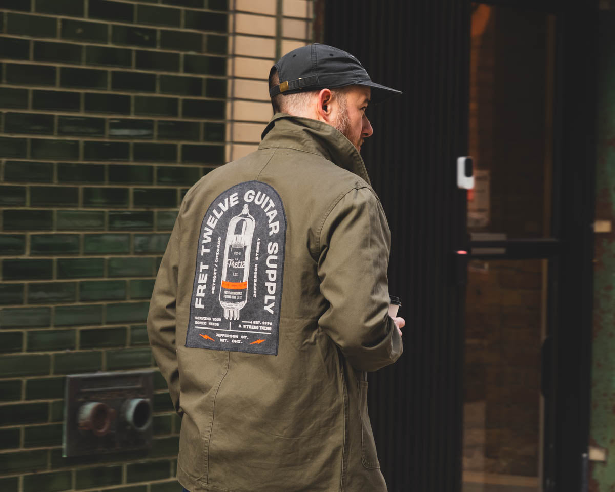 Featured here is an artist walking in Chicago wearing a limited edition Sonic Needs Craft Coat, and the 12 hat, all made by FRET12