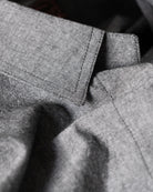 Close-up of gray fabric with a focus on texture and pattern