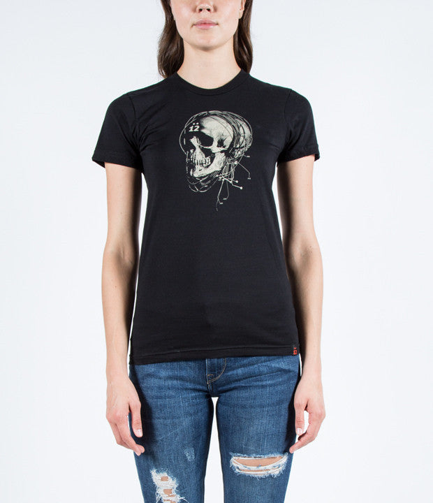 Model wearing black tee with Strung Out Skull design and woven 12 tag at waist.