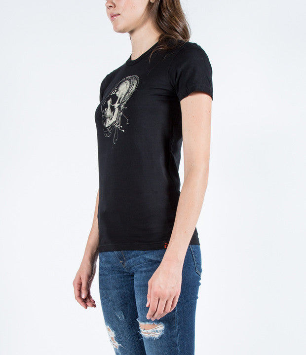 Sideview of model wearing Strung Out Skull tee.