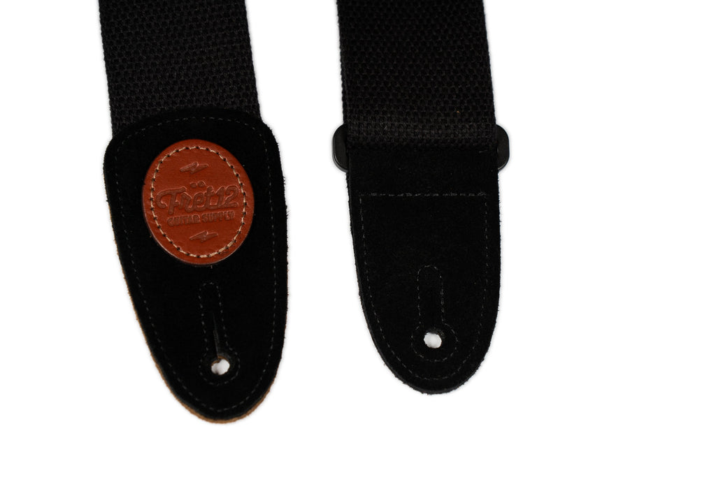 Close-up of the strap's suede ends, emblazoned with a FRET12 insignia.