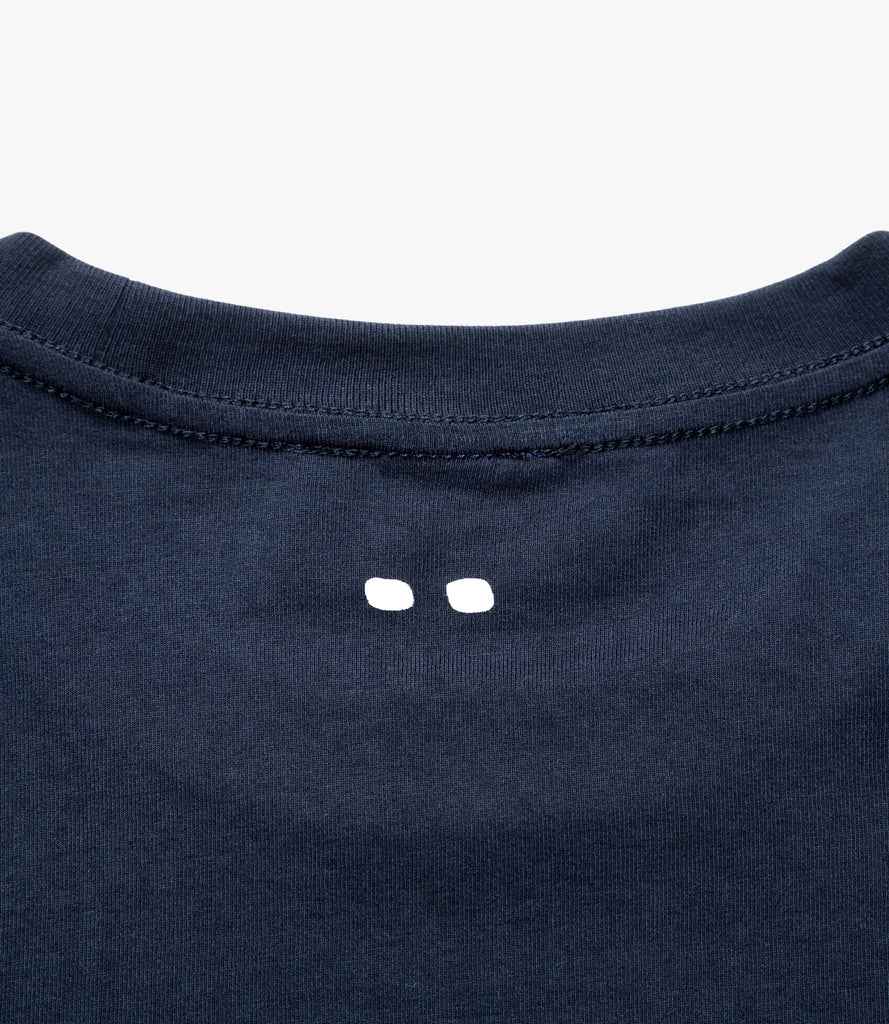 Closeup of white Double Dot print on back of neck.