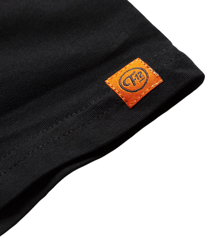 Closeup of woven F12 logo sewn on sleeve.