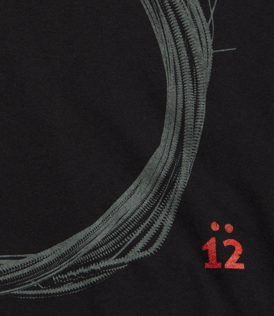 Closeup of red 12 below Coil Logo.