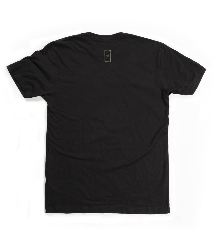 Back of black tee with "F" graphic.