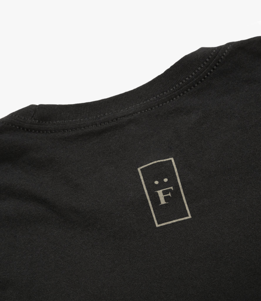 Closeup of "F" graphic on back of neck.